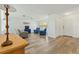 Open living room featuring hardwood floors, neutral walls, and comfortable seating at 917 Pineview Ave, Clearwater, FL 33756