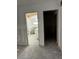 View of a bathroom renovation with a toilet and bathtub ready for finishing touches, with an unfinished floor at 103 9Th St, Belleair Beach, FL 33786