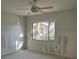 Bedroom under renovation featuring a window offering natural light and a ceiling fan for added comfort at 103 9Th St, Belleair Beach, FL 33786