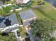 Aerial view of home showing roof, solar panels, landscaping, and surrounding neighborhood at 10523 Boyette Creek Blvd, Riverview, FL 33569