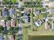 Overhead view of a single-Gathering home in a residential neighborhood with lake views at 10523 Boyette Creek Blvd, Riverview, FL 33569
