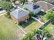 Aerial view showcasing spacious backyard, privacy fence and surrounding neighborhood at 10523 Boyette Creek Blvd, Riverview, FL 33569
