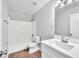 Well-lit bathroom with a shower-tub combo, stylish vanity, and modern fixtures at 10523 Boyette Creek Blvd, Riverview, FL 33569