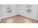 Corner bedroom filled with natural light offers a view of the neighborhood and a pond at 10523 Boyette Creek Blvd, Riverview, FL 33569