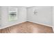 Cozy bedroom featuring light wood floors and natural light at 10523 Boyette Creek Blvd, Riverview, FL 33569
