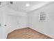 Walk-in closet featuring wood-look floors, white walls, a window and wire shelving at 10523 Boyette Creek Blvd, Riverview, FL 33569
