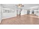 Open-concept living area with seamless flow between living, dining, and modern kitchen at 10523 Boyette Creek Blvd, Riverview, FL 33569