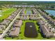 Community aerial view showcases landscaped lawns and lake views at 11519 Crowned Sparrow Ln, Tampa, FL 33626