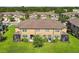 Lush green backyard featuring screened-in patio and verdant lawn at 11519 Crowned Sparrow Ln, Tampa, FL 33626