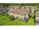 Lush green backyard featuring screened-in patio and verdant lawn at 11519 Crowned Sparrow Ln, Tampa, FL 33626