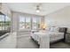 Relaxing bedroom with soft decor, comfortable bed, and bright window light creating a cozy atmosphere at 11519 Crowned Sparrow Ln, Tampa, FL 33626