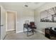 Bedroom featuring computer desk, leather chair and ceiling fan at 11519 Crowned Sparrow Ln, Tampa, FL 33626
