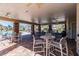 The community area has tables, chairs, and fans under a covered area alongside a swimming pool at 11519 Crowned Sparrow Ln, Tampa, FL 33626