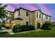 Charming two-story home with a well-manicured lawn and lush landscaping, perfect for a Gathering at 11519 Crowned Sparrow Ln, Tampa, FL 33626