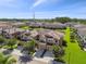 Beautiful two-story townhome with a two-car garage, well-manicured lawn, and balcony at 11519 Crowned Sparrow Ln, Tampa, FL 33626