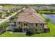Charming two-story townhome with lush lawn, manicured landscaping and inviting entrance at 11519 Crowned Sparrow Ln, Tampa, FL 33626