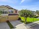 Charming two-story townhome with a two-car garage and a well-manicured front lawn at 11519 Crowned Sparrow Ln, Tampa, FL 33626