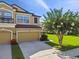 Charming two-story home featuring a two-car garage, manicured lawn, and beautiful landscaping in a well-maintained community at 11519 Crowned Sparrow Ln, Tampa, FL 33626