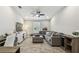 Comfortable living room with wood floors, ceiling fan, modern furnishings and plenty of natural light at 11519 Crowned Sparrow Ln, Tampa, FL 33626