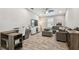 Comfortable living room with wood floors, ceiling fan, modern furnishings and plenty of natural light at 11519 Crowned Sparrow Ln, Tampa, FL 33626