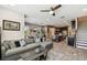 Open-concept living room seamlessly connects to the kitchen and dining area, promoting an airy and inclusive atmosphere at 11519 Crowned Sparrow Ln, Tampa, FL 33626