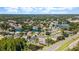 A beautiful aerial view showcases a community with lakes and ponds surrounded by lush trees and homes at 12910 Vicksburg Dr, Tampa, FL 33625