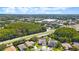 Overhead view features a community close to shopping, roadways, and lots of trees at 12910 Vicksburg Dr, Tampa, FL 33625