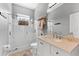 Bright bathroom with glass enclosed shower, vanity and granite countertops at 12910 Vicksburg Dr, Tampa, FL 33625