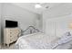 Comfortable bedroom featuring a bed, carpeted floors and white trim at 12910 Vicksburg Dr, Tampa, FL 33625