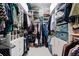 Walk-in closet with ample shelving and storage space, offering organization at 12910 Vicksburg Dr, Tampa, FL 33625