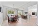 Elegant dining room with mirrored wall and large window, creating an inviting space at 12910 Vicksburg Dr, Tampa, FL 33625