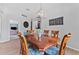 Dining room featuring an updated light fixture, wood table, and comfortable seating at 12910 Vicksburg Dr, Tampa, FL 33625