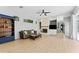 Cozy living room with a stone fireplace, comfortable seating, and natural light, creating a relaxing atmosphere for Gathering time at 12910 Vicksburg Dr, Tampa, FL 33625