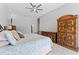 Large main bedroom featuring neutral paint, ceiling fan, and en suite bathroom at 12910 Vicksburg Dr, Tampa, FL 33625
