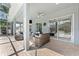 A beautiful covered patio features ample lounge seating and seamless access to the outdoors at 12910 Vicksburg Dr, Tampa, FL 33625