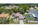 Aerial view of a home in a neighborhood featuring a large yard, trampoline, and surrounding fence at 13337 Tubeck St, Spring Hill, FL 34609