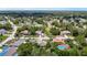 An expansive aerial shot of a neighborhood dotted with houses, trees, and roadways at 13337 Tubeck St, Spring Hill, FL 34609