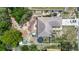 Aerial view of house showing roof, backyard, and surrounding fences and trees in the neighborhood at 13337 Tubeck St, Spring Hill, FL 34609