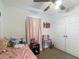 A charming bedroom features a ceiling fan, carpeted floor, closet, and lots of personality at 13337 Tubeck St, Spring Hill, FL 34609