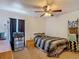 Bedroom with a dresser, ceiling fan, and black-out curtains at 13337 Tubeck St, Spring Hill, FL 34609