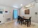 Cozy dining area with natural light, a ceiling light, tile flooring, and calming decor at 13337 Tubeck St, Spring Hill, FL 34609