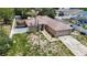 Street view of a single story home with a two-car garage, fenced yard, and driveway at 13337 Tubeck St, Spring Hill, FL 34609