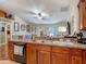 Open kitchen showcases a stainless steel sink and faucet overlooking the living area at 13337 Tubeck St, Spring Hill, FL 34609