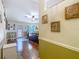 Open living area showcasing hardwood floors, decorative wall, and view of the backyard at 13337 Tubeck St, Spring Hill, FL 34609