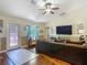 Spacious living room boasts hardwood floors and exterior access to enjoy the outdoors at 13337 Tubeck St, Spring Hill, FL 34609