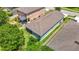 Aerial view of a charming home showcasing a well-maintained lawn and inviting outdoor spaces at 13806 Reindeer Cir, Hudson, FL 34669
