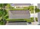 Birds eye view of a single Gathering home and landscaping showing the roof and driveway at 13806 Reindeer Cir, Hudson, FL 34669