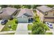 Aerial view of a home highlighting its layout, landscaping, and neighborhood at 13806 Reindeer Cir, Hudson, FL 34669