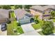 This home boasts a well-manicured front yard, two car garage and lovely curb appeal at 13806 Reindeer Cir, Hudson, FL 34669