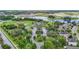 Aerial view of the community center with pool, tennis courts and surrounding homes at 13806 Reindeer Cir, Hudson, FL 34669